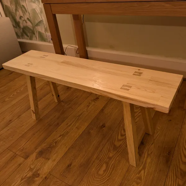 A bench made from pine wood with handcut joinery. by Wondiu