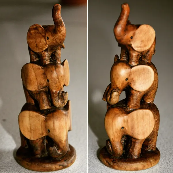 Three elephants stacked on top of each other, carved out of cedar wood by Wondiu