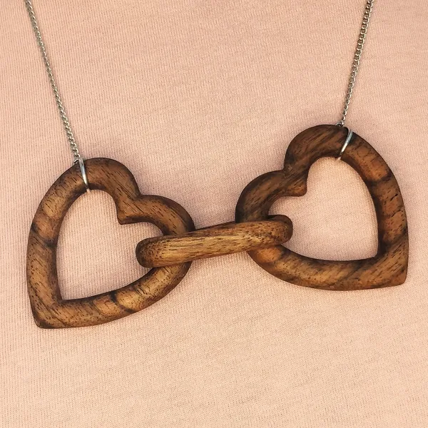 Heart chain necklace carved from a single piece of walnut. by Wondiu