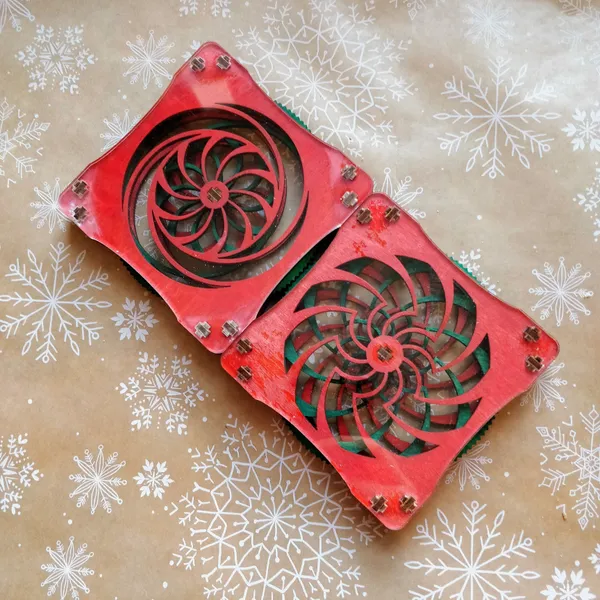 A set of 2 kinetic coasters with visible spinning spirals, from designer Ross McSweeney. by Wondiu