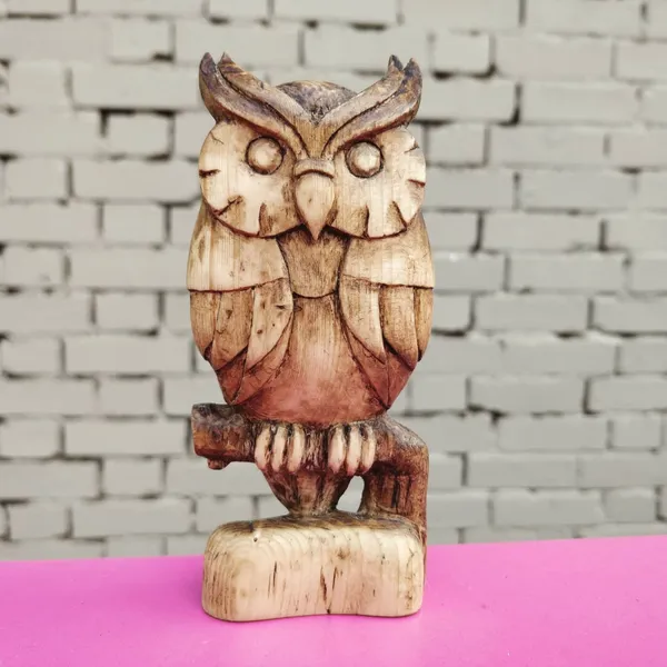 An owl carved from pine wood. by Wondiu